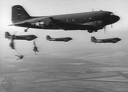 American Paratroopers jump from the C-47 in D-Day invasion stripes